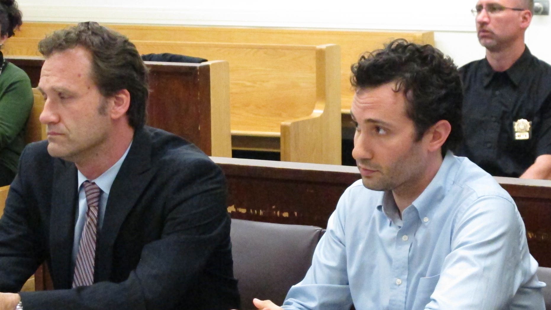 Former Fox News employee Joseph Muto (r.) and attorney Florian Meidel (l.) appear in court where Muto admitted his role in posting stolen video on a website. (Fox News)