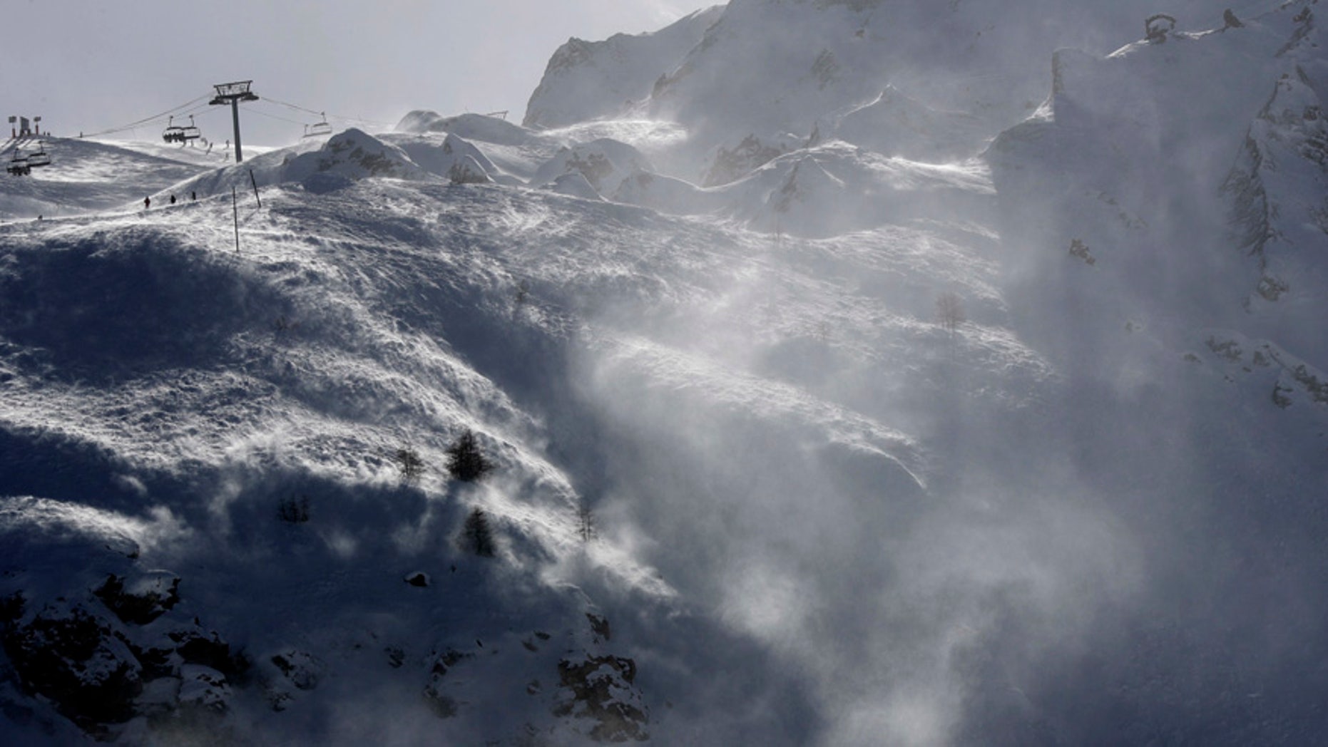 FILE - This Feb. 14, 2017 file photo shows the Lavachet Wall at the Tignes ski resort, French Alps. French officials say an avalanche has struck the Alpine ski resort of Tignes Tuesday March 7, 2017, and rescue services have launched a search. (AP Photo/Luca Bruno, File)