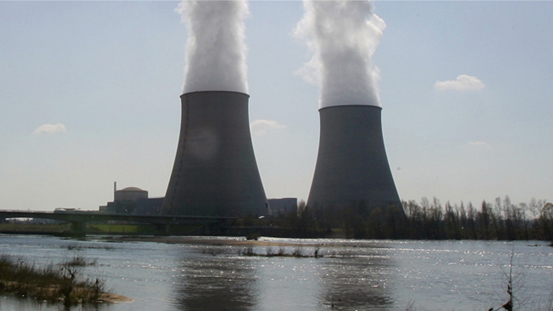 March 27, 2007:This file photo shows the Belleville-sur-Loire's nuclear plant, across the Loire river, central France. French security chiefs are investigating a spate of mysterious and illegal overflights of French nuclear power stations by tiny, unmanned drones. A government official told The Associated Press that authorities have counted about 15 drone flights over a half-dozen nuclear sites since Oct. 1