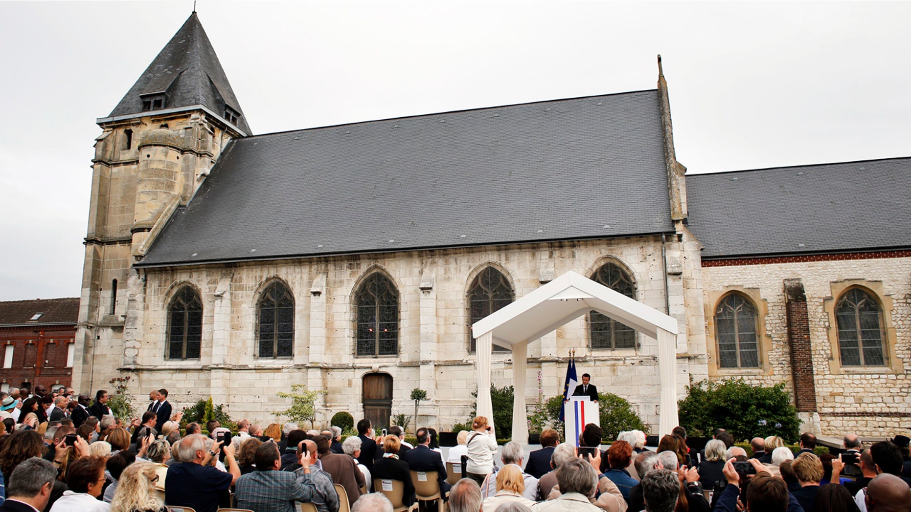 France's President Emmanuel Macron delivers a speech during a ceremony marking the first anniversary of the killing of Catholic priest Jacques Hamel by two jihadists at his church.