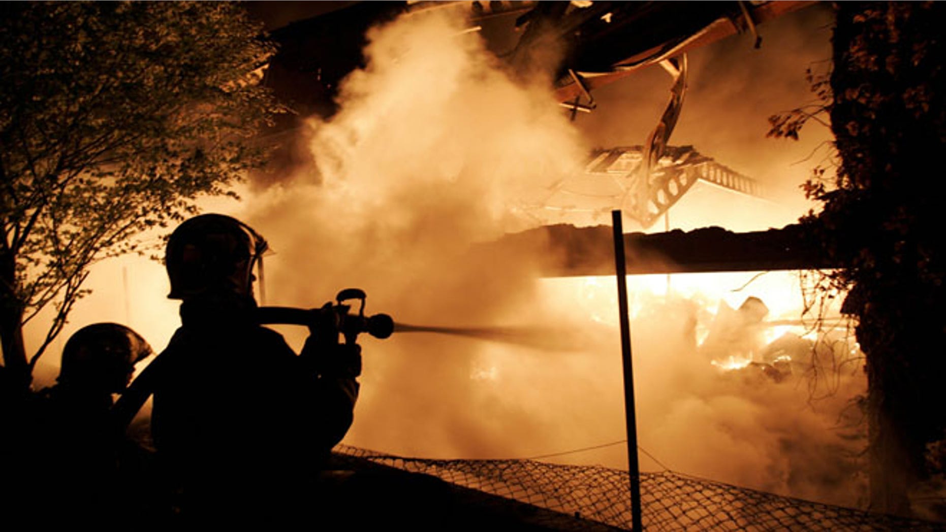 Many of France's "sensitive urban zones," called "no-go" zones by some observers, typically keep to themselves, but are apt to flare up on occasion, experts say. In 2005, the accidental deaths of two teenagers in an impoverished Paris suburb during a police sweep touched off a national wave of unrest, leading to rioting and the torching of schools, community centers and thousands of cars. Here, French firemen confront a blazing warehouse fire near Le Bourget on Nov. 4, 2005.
