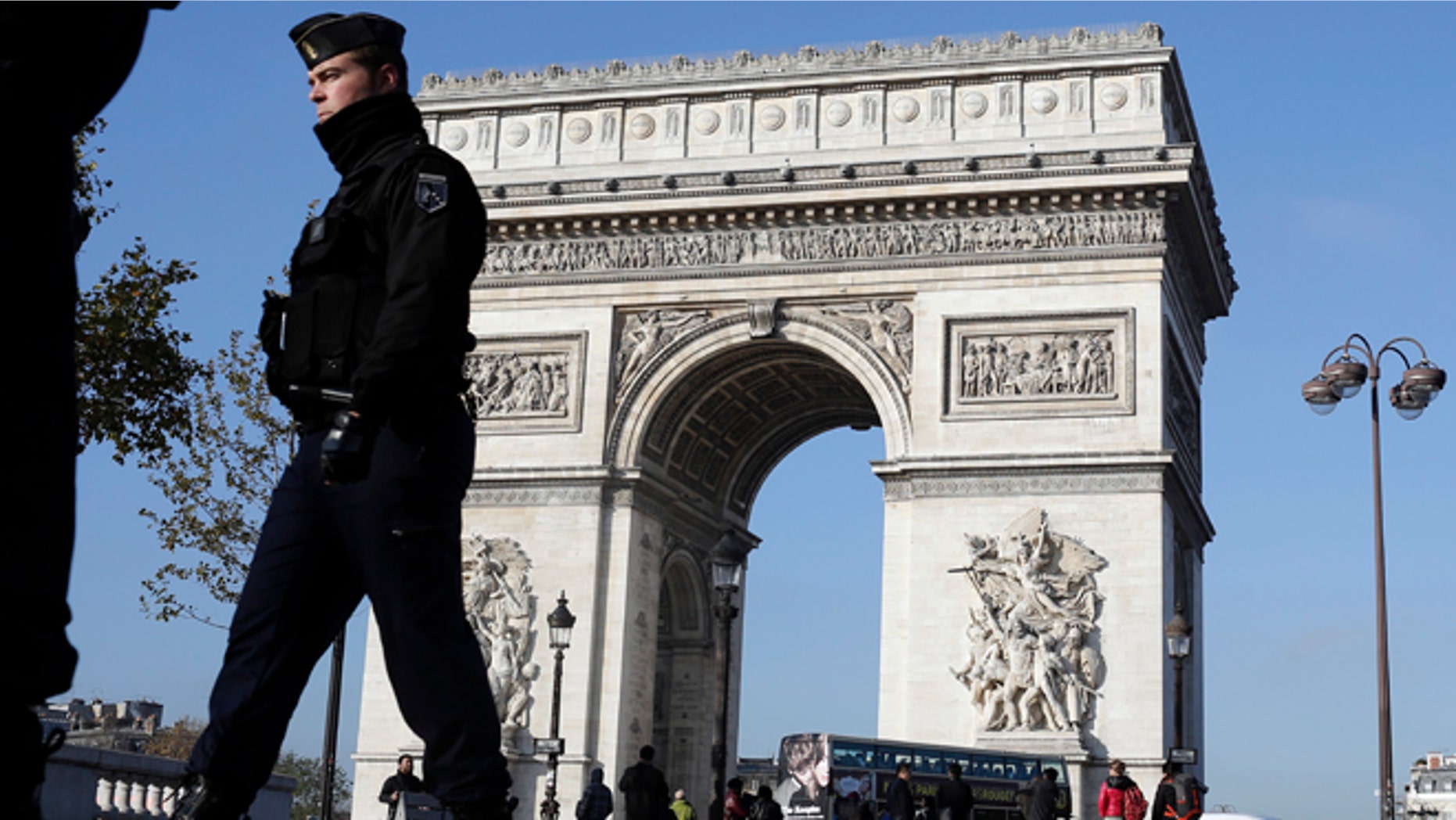 Nov. 23, 2015: A French gendarme officer patrols in front of the Arc de Triomphe, on the Champs Elysees, in Paris.
