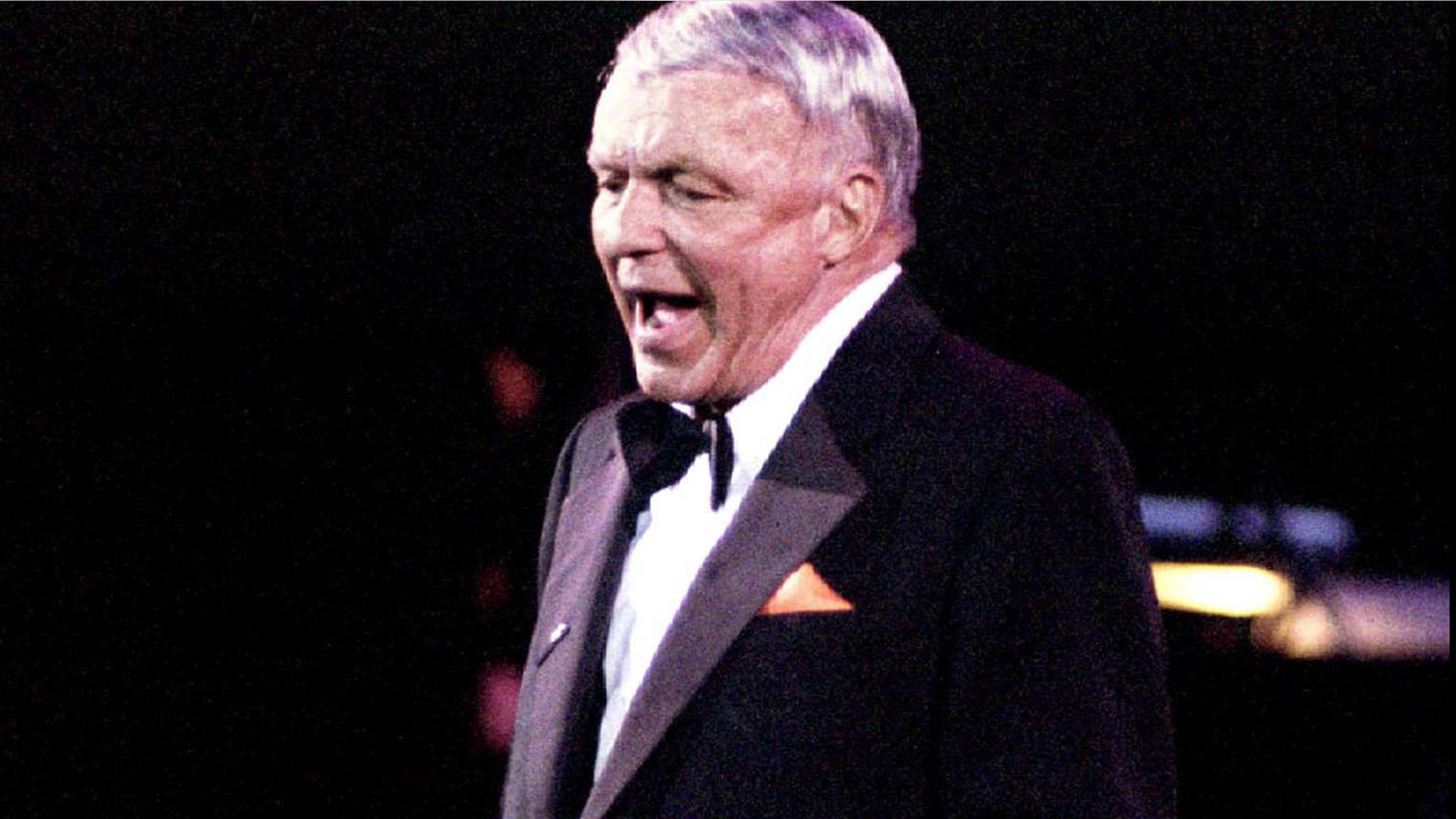 Frank Sinatra belts out a song during a concert in Manila in this file photo of June 28, 1994.