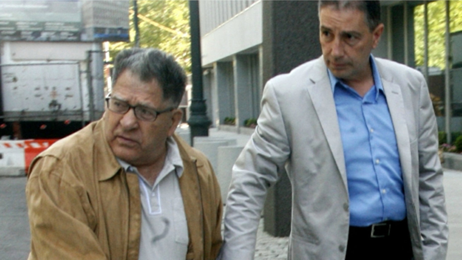 June 15, 2010: John "Sonny" Franzese, left, arrives at federal court in Brooklyn, New York. To the dismay of supporters who insist the frail 93-year-old is a decrepit shadow of his former self, the government has asked a judge in federal court in Brooklyn to sentence him on Friday to 12 years or more in prison. (AP)