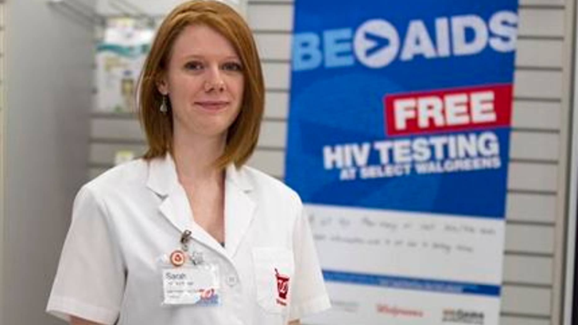 Walgreen's pharmacy manager Sarah Freedman stands in her store in Washington, Tuesday, June 26, 2012. Would you go to a pharmacy to get tested for the AIDS virus? Health officials want to know. The Centers for Disease Control and Prevention on Tuesday announced a $1.2 million pilot project to offer free rapid HIV tests at pharmacies and clinics in 24 cities and rural communities. (AP Photo/Evan Vucci)