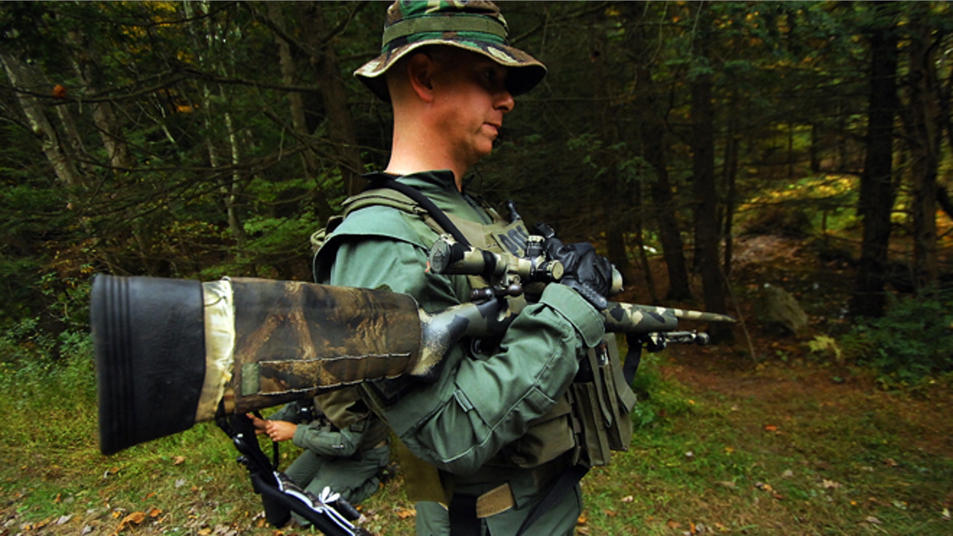 Oct. 2, 2014: A member of the Scranton, Pa., Police Special Operations Group, prepares to search the woods in Barrett Township near Canadensis, Pa., for suspected killer Eric Frein.