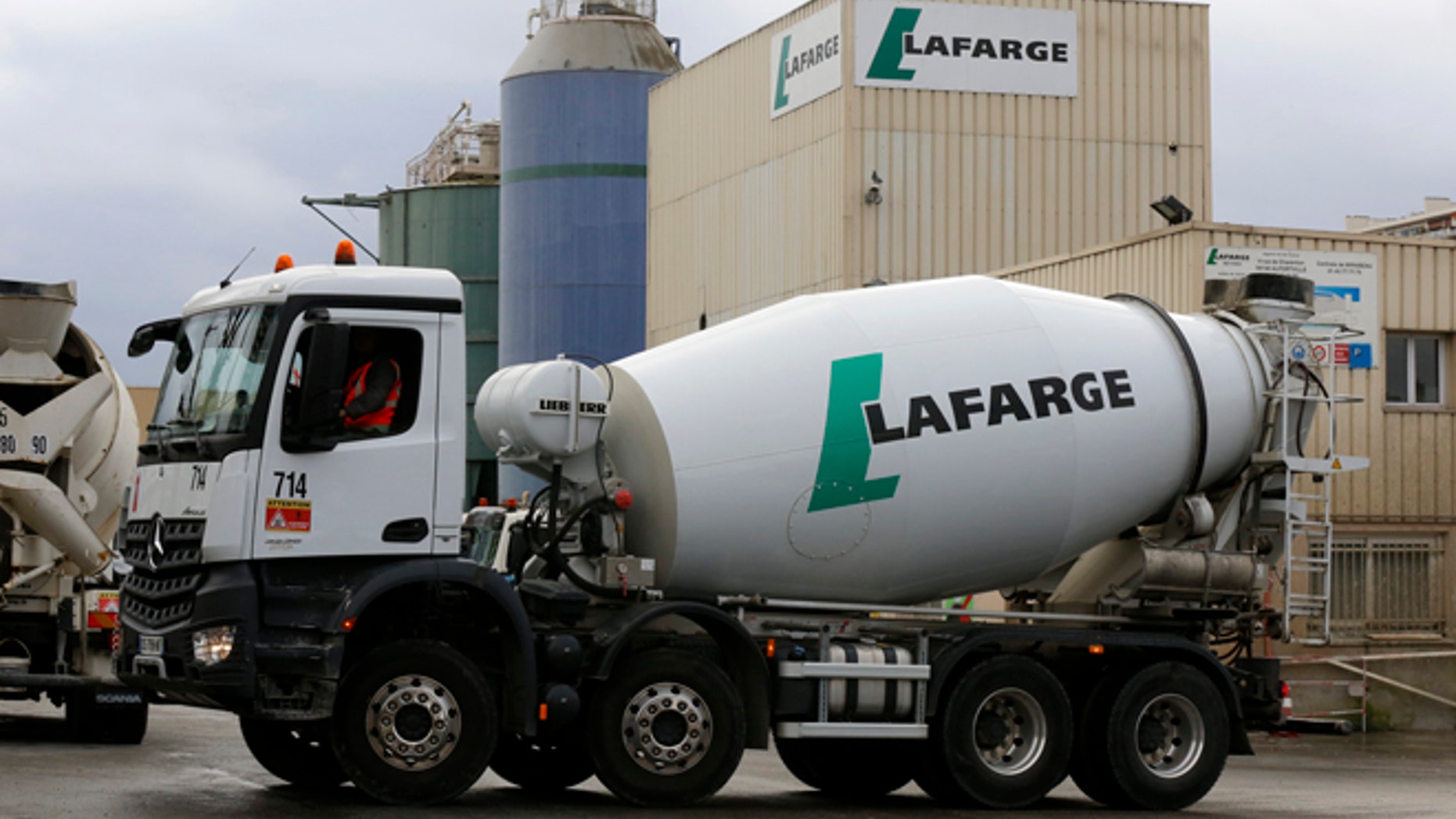 The logo of French building material Lafarge is seen on cement trucks at a production plant in Paris, France, February 22, 2016.