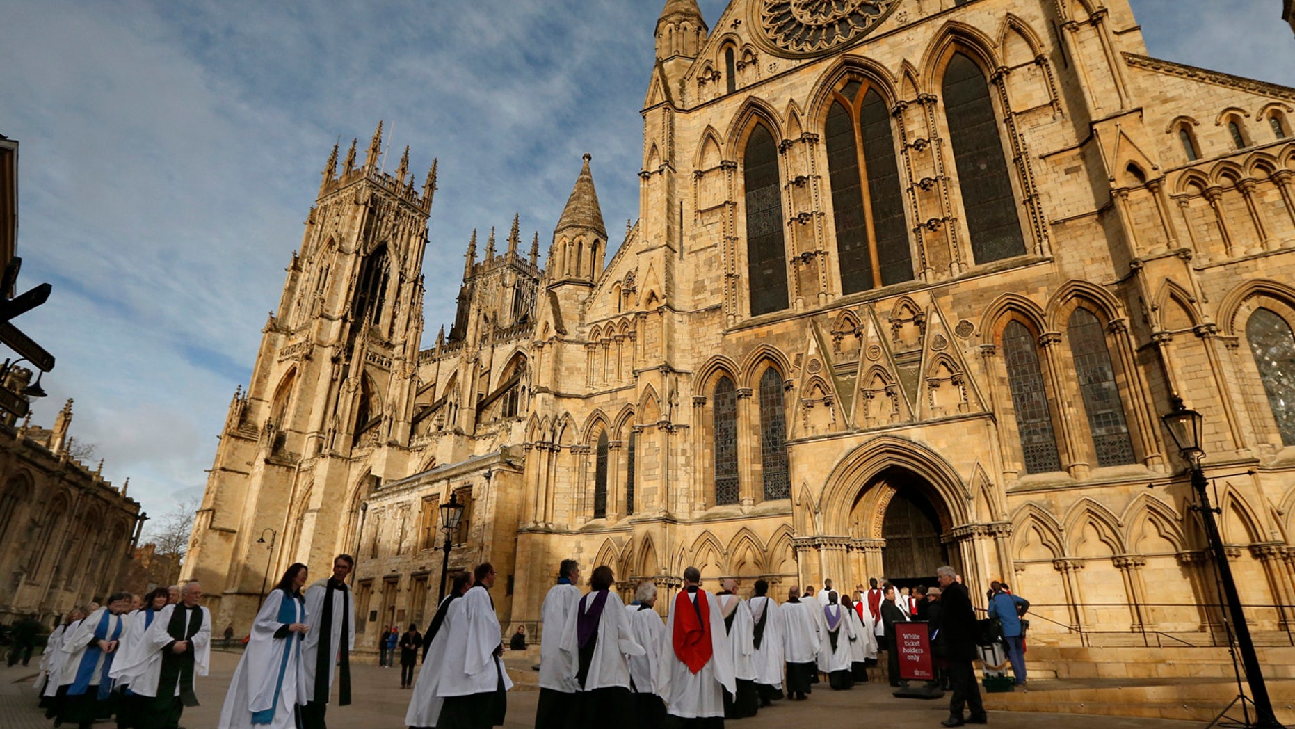 Members of the clergy enter York Minster before a service to consecrate Reverend Libby Lane as the first female bishop in the Church of England, in York, northern England January 26, 2015. REUTERS/Phil Noble (BRITAIN - Tags: RELIGION) - GM1EB1Q1HRE01