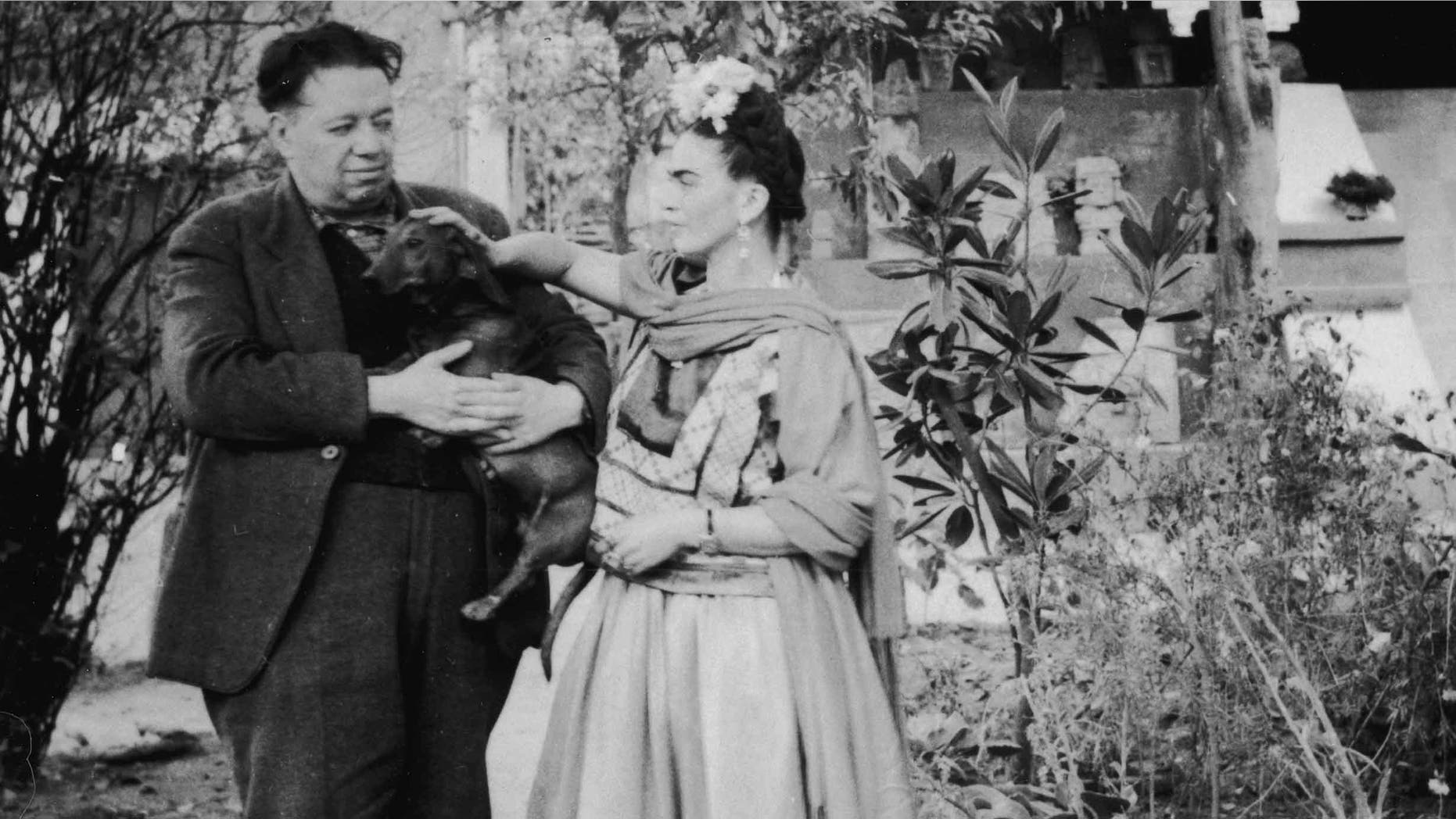 Frida Kahlo and Diego Rivera with a pet dog in Mexico City, Mexico, 1940s.