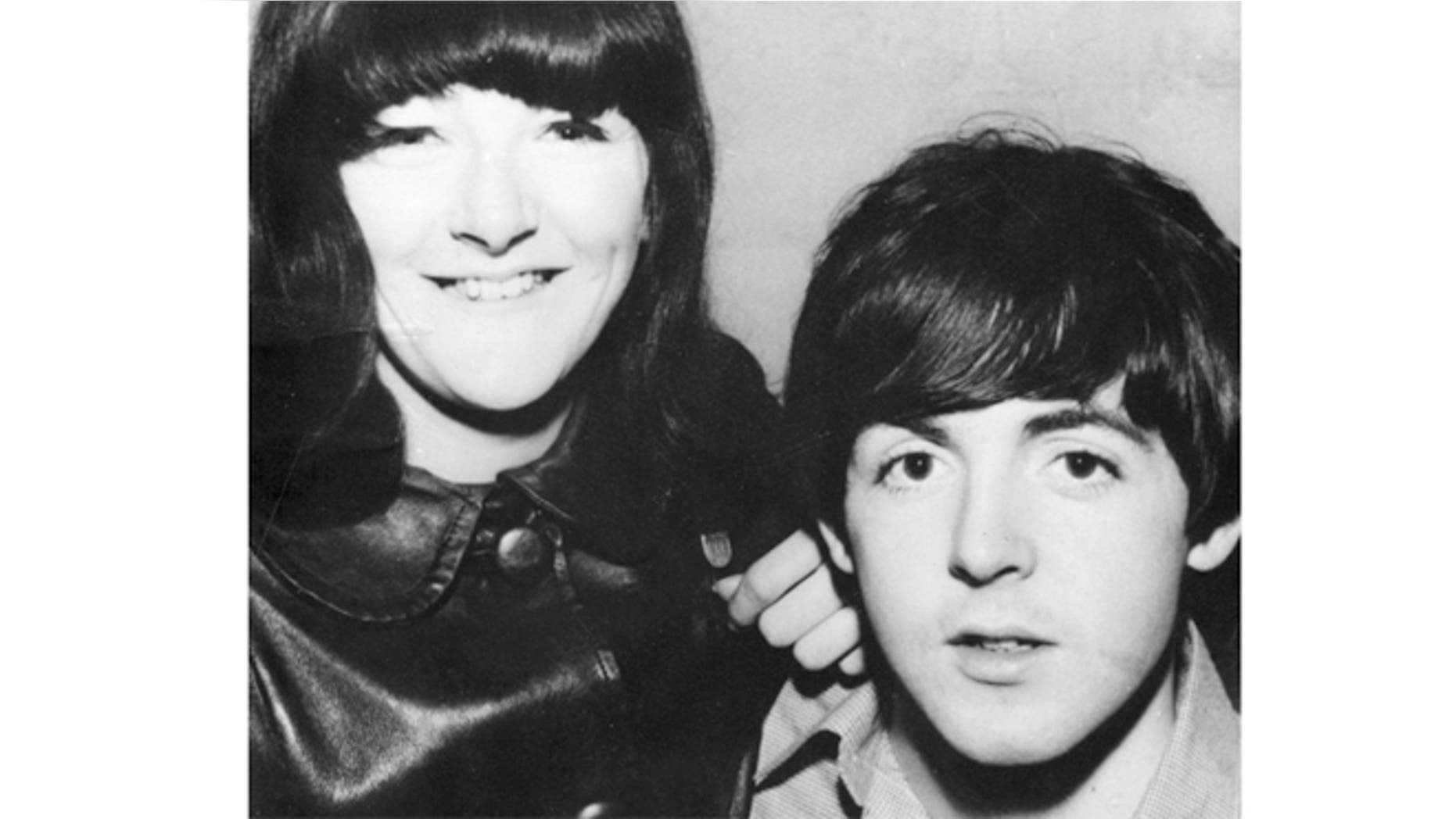Freda Kelly is seen posing with Paul McCartney.