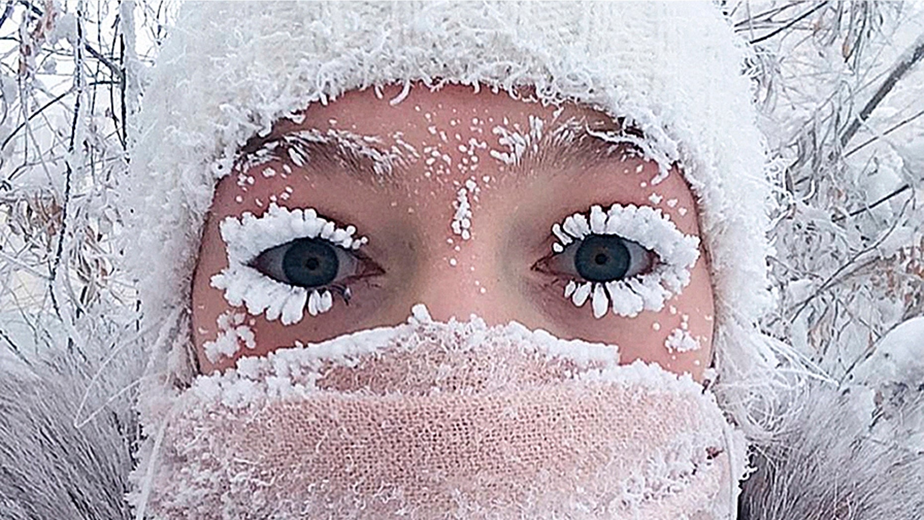 In this photo taken on Saturday, Jan. 13, 2018, Anastasia Gruzdeva poses for selfie as the temperature dropped to about -58 degrees F in Yakutsk, Russia.