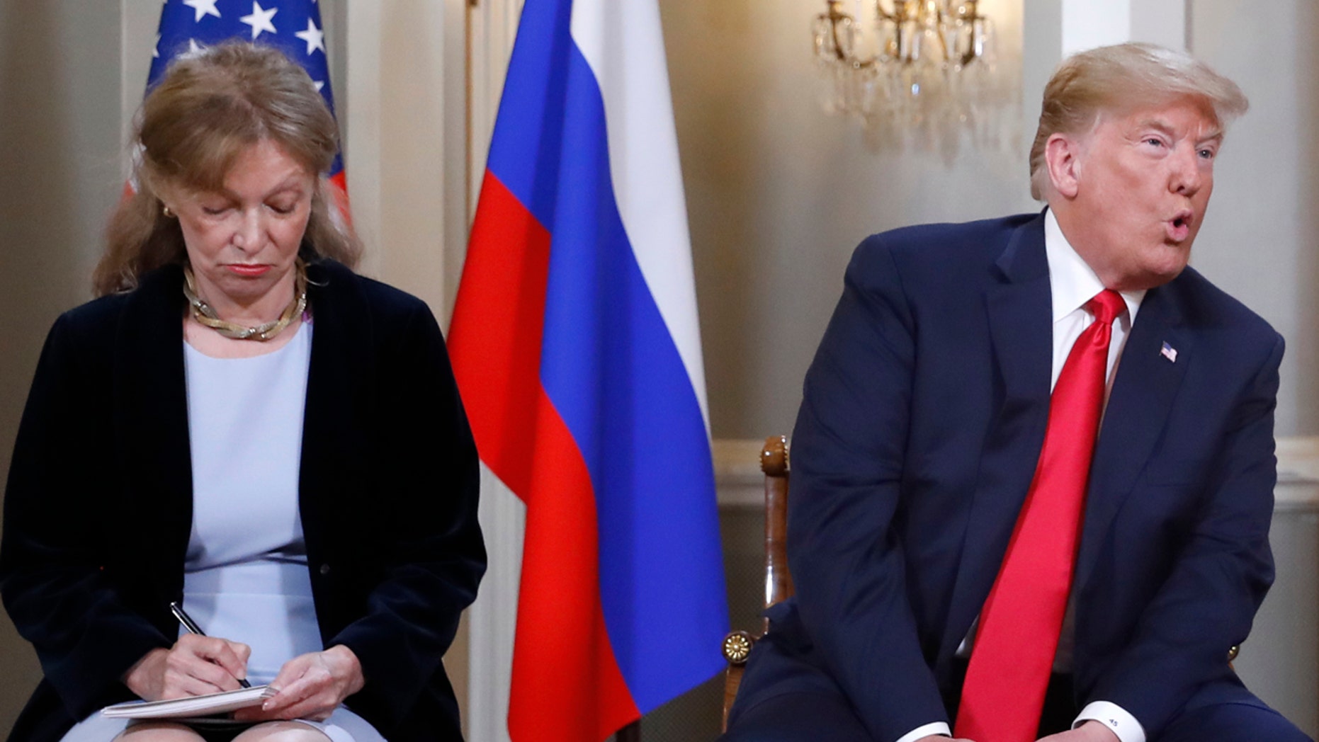 July 16: Interpreter Marina Gross takes notes while President Trump talks to Russian President Vladimir Putin.
