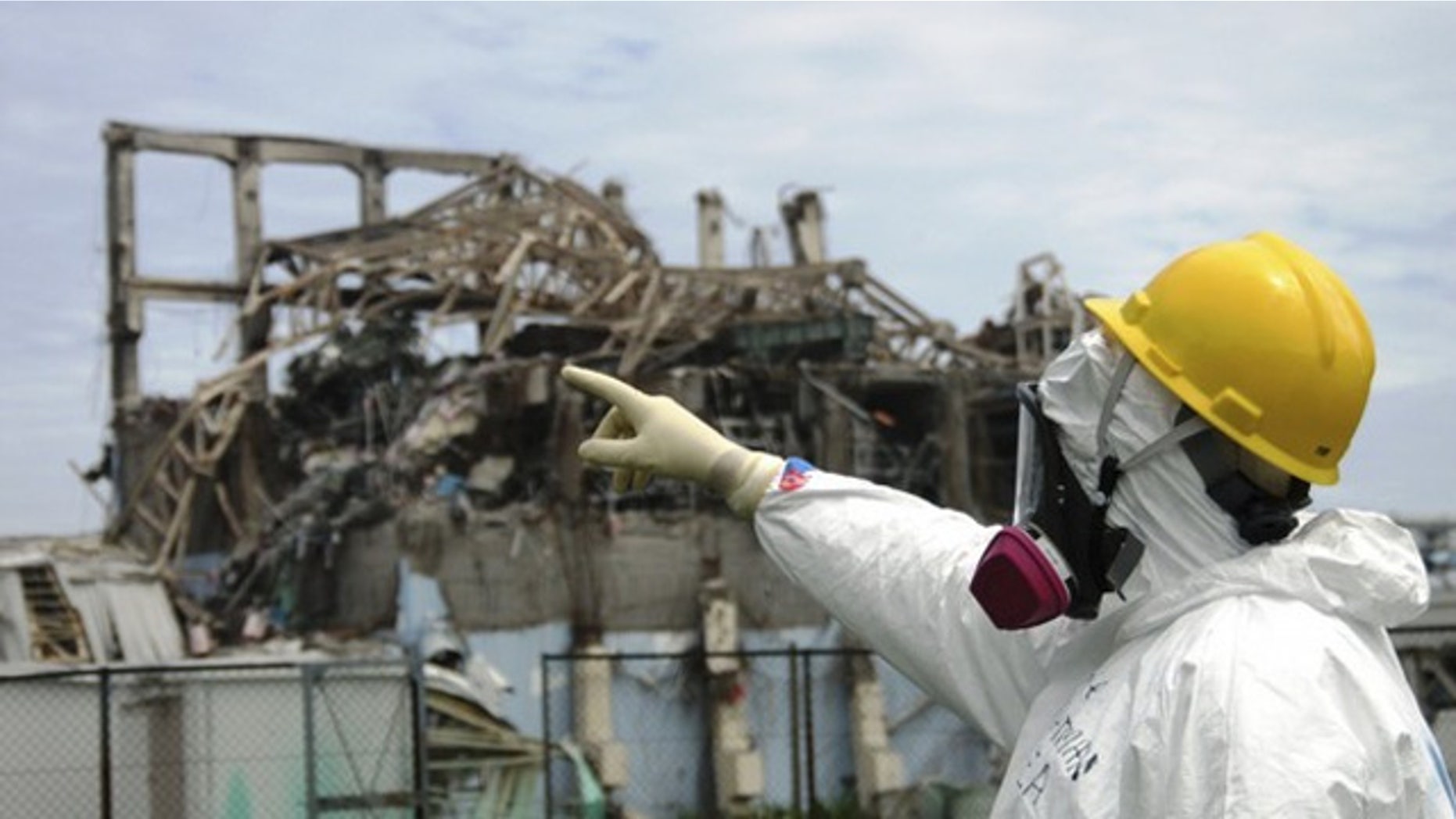 International Atomic Energy Agency (IAEA) fact-finding team leader Mike Weightman examines the No. 3 reactor at the Fukushima Daiichi Nuclear Power Plant. Radioactive sulfur from the disaster reached California, according to researchers.