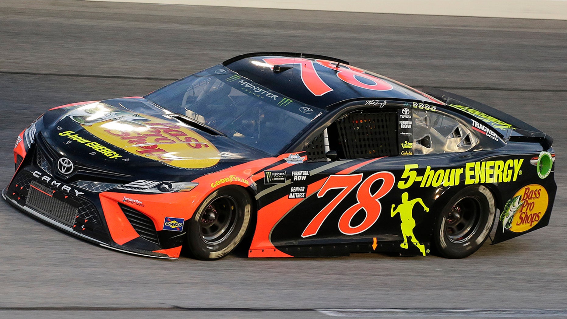 Martin Truex Jr. drives into Turn 1 during the NASCAR Cup Series auto race at Darlington Raceway, Sunday, Sept. 2, 2018, in Darlington, S.C. (AP Photo/Terry Renna)