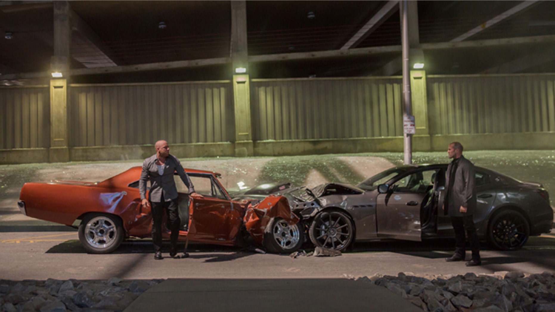 Vin Diesel, left, as Dom Toretto, and Jason Statham, as Deckard Shaw, in a scene from "Furious 7."