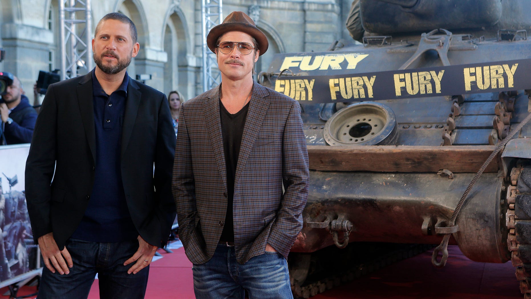 October 18, 2014. Brad Pitt, right, and director David Ayer pose for photographers during the photocall of "Fury" in Paris.