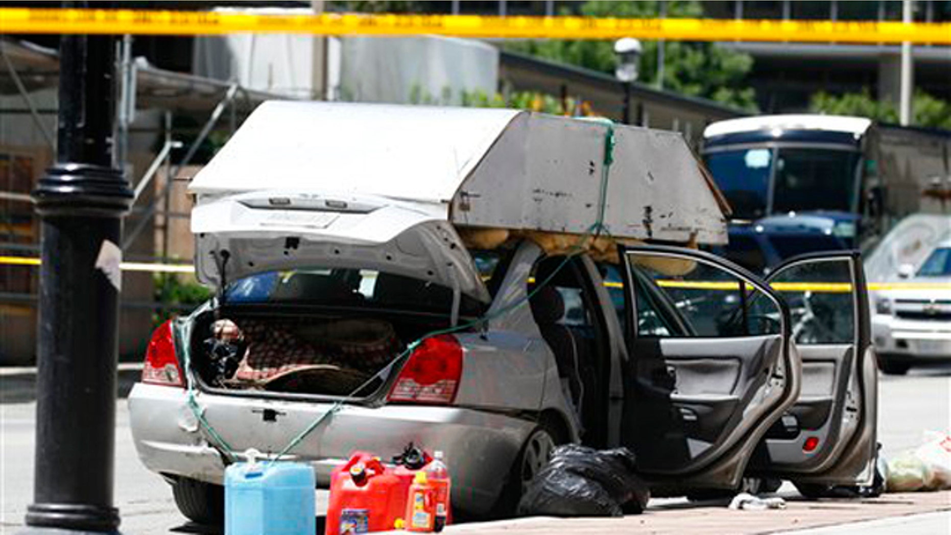 June 24: A car seized by police sits near the intersection of Scott Street and Esplanade in Toronto.