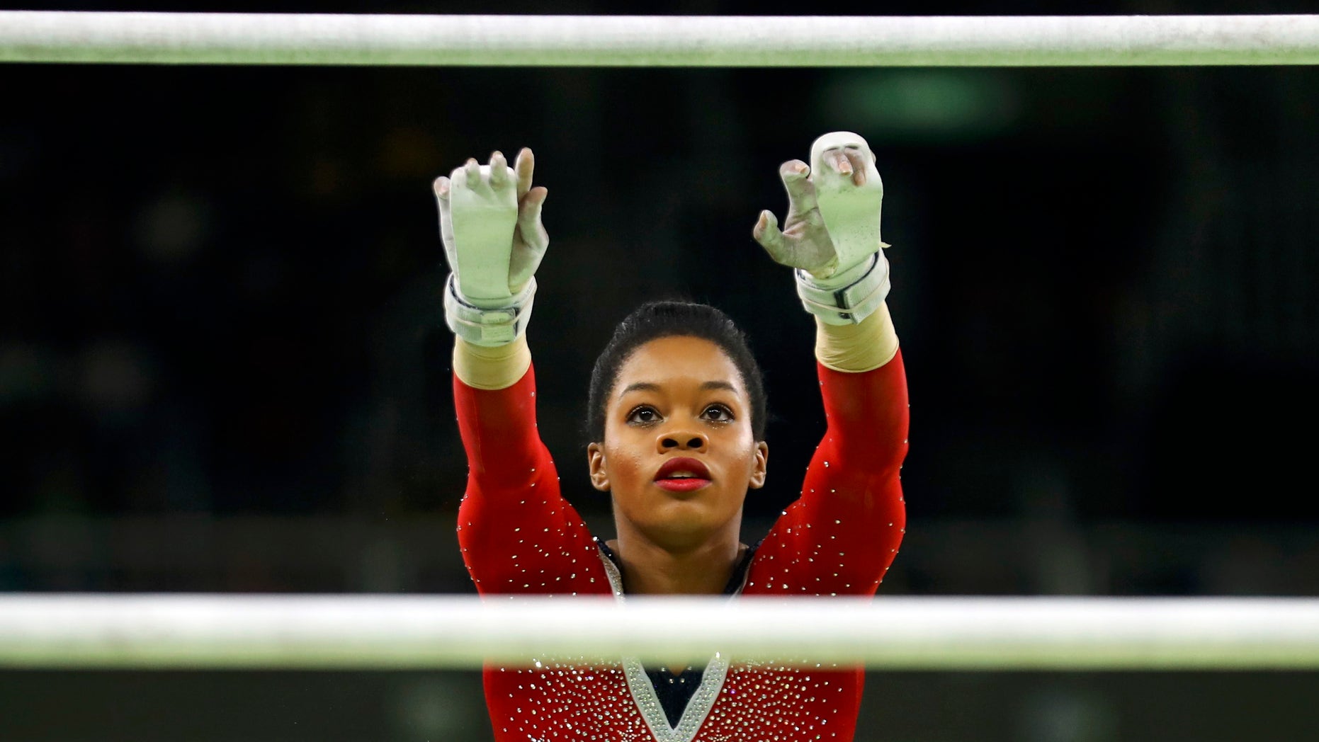 2016 Rio Olympics - Artistic Gymnastics - Final - Women's Uneven Bars Final - Rio Olympic Arena - Rio de Janeiro, Brazil - 14/08/2016. Gabrielle Douglas (USA) of USA (Gabby Douglas) competes. REUTERS/Mike Blake FOR EDITORIAL USE ONLY. NOT FOR SALE FOR MARKETING OR ADVERTISING CAMPAIGNS. - RTX2KSFI
