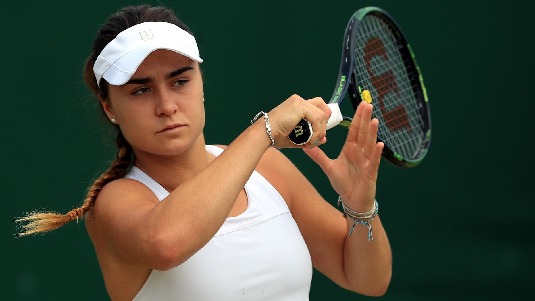 This is a July 2016 file photo of of rising British tennis star Gabriella Taylor in action at Wimbledon London. British police are investigating allegations that Taylor a player at the Wimbledon tennis tournament was poisoned, after she fell ill with a bacterial infection that can be spread through rat urine. Gabriella Taylor was playing in the junior tournament when she became sick.