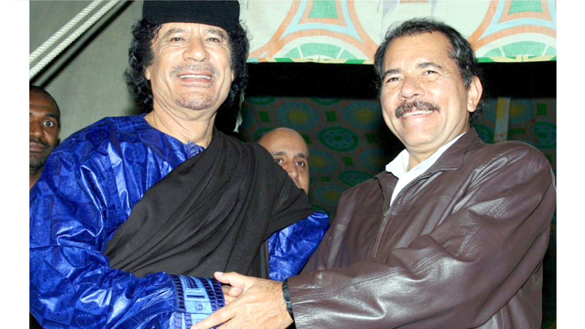 In this handout photo released by Presidential House of Nicaragua, Libyan leader Moammar Gadhafi, left, shakes hands with Nicaragua's President Daniel Ortega during a meeting in Tripoli, Libya, Tuesday, June 5, 2007.(AP Photo/Presidential House of Nicaragua/Jairo Cajina) ** NO SALES **