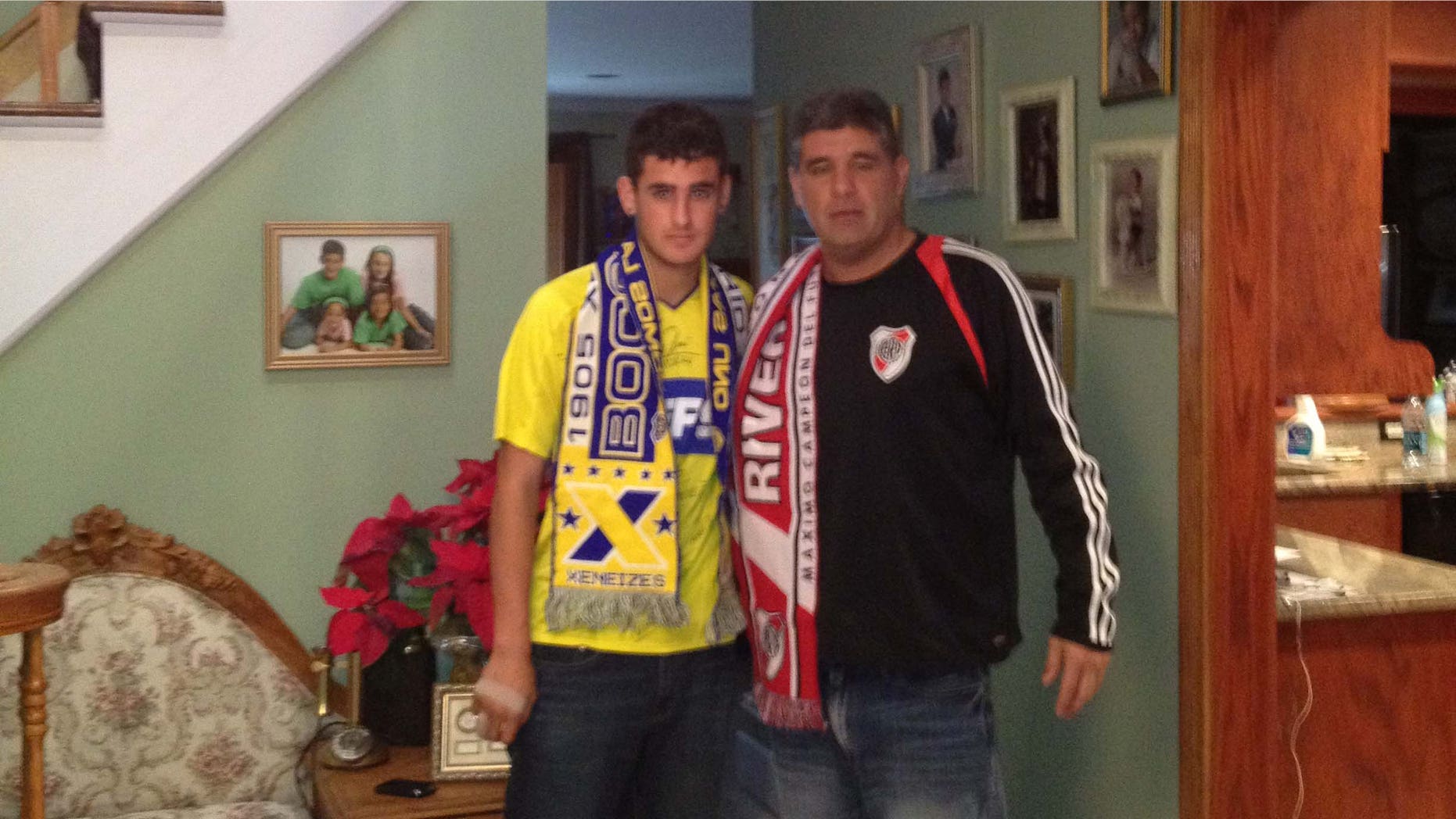 Photo of Nicholas (left) and Adrian Gaitan wearing the colors of their favorite Argentine clubs.Nicholas is a Boca Juniors fans, Adrian a River Plate supporter. Photo courtesy of the Gaitan family