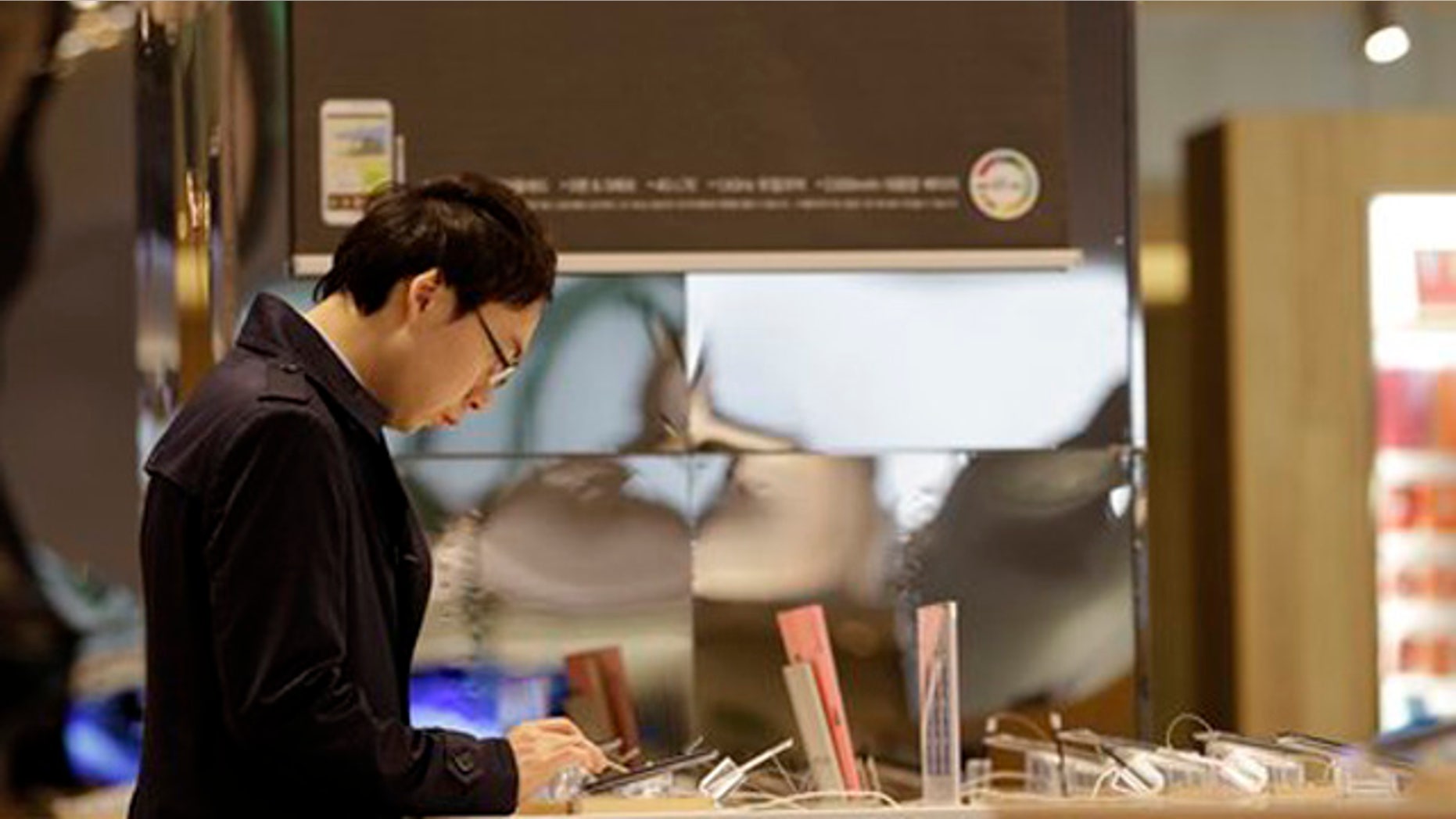 April 6, 2012: A visitor operates a Galaxy tablet of Samsung Electronics at a showroom of its headquarters in Seoul, South Korea.