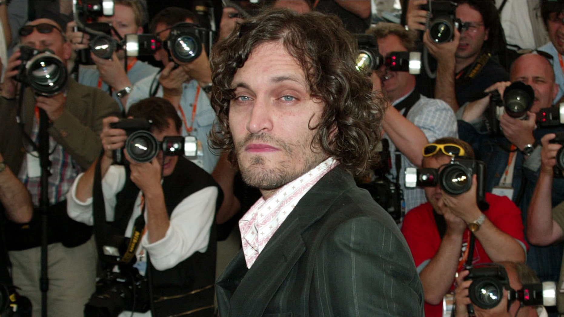 US director and actor Vincent Gallo poses during a photocall for his film "The Brown Bunny" at the 56th International Film Festival in Cannes, May 21, 2003. Gallo's film entry is one of twenty in competition for the Palme d'Or (Golden Palm) at the 12-day film festival on the French Riviera.
