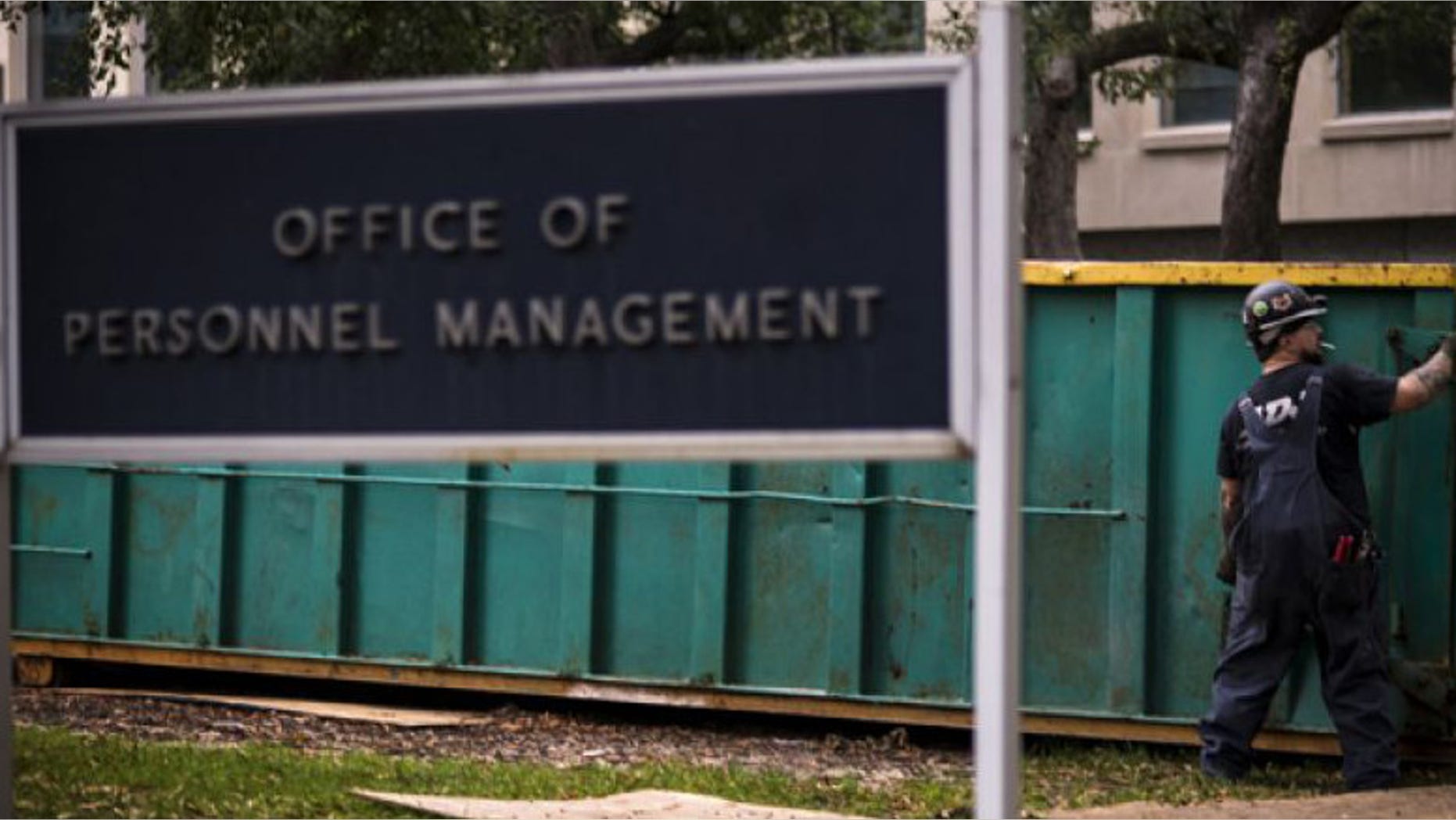 In this Thursday, Oct. 17, 2013 photo, a worker is seen at the Office of Personnel Management in Washington.