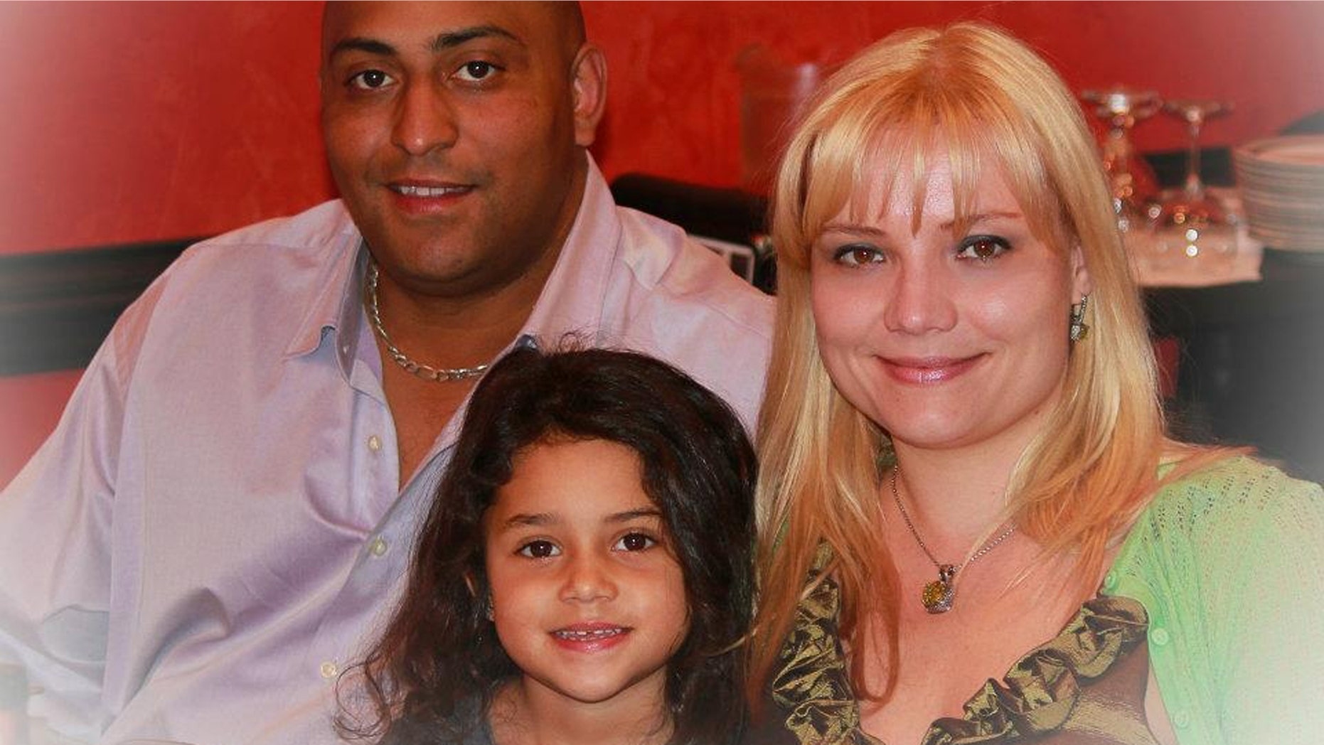 Hamlet Garcia, 42, his wife, Olesia Garica, 34, and their seven year old daughter Fiorella.