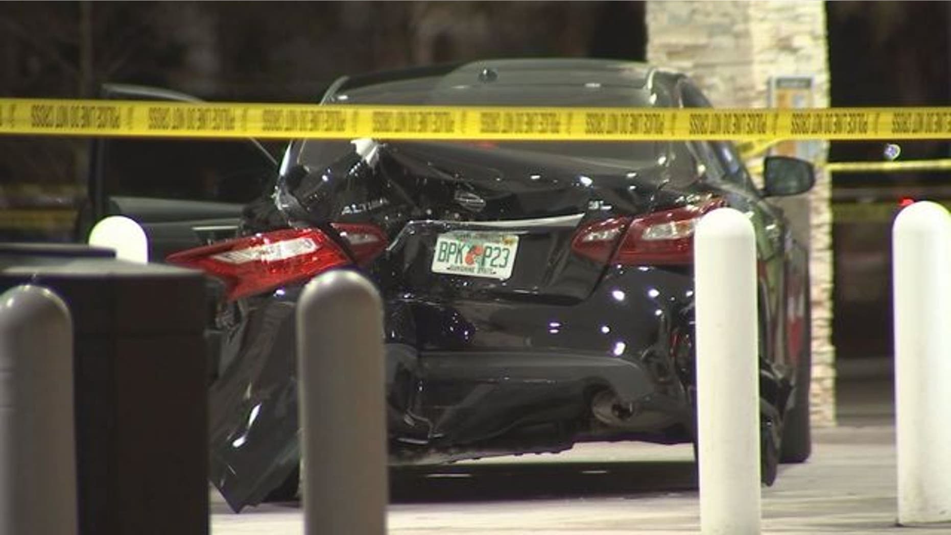 A black Nissan sedan is seen at a gas station in Largo, Fla., after a driver's confrontation with a police officer, March 23, 2018.