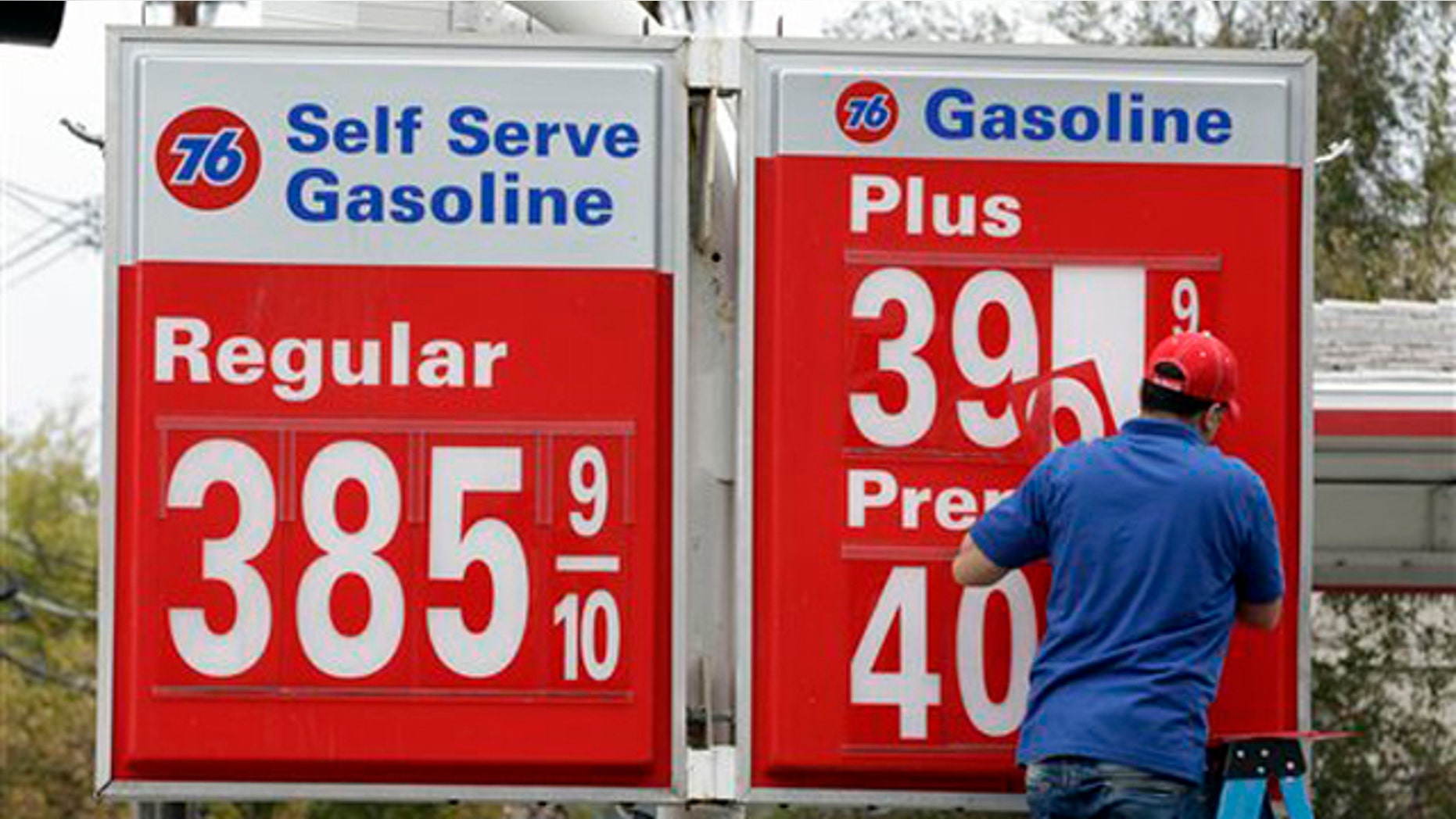 Nov. 11, 2011: A worker changes the gas prices at his Union 76 gas station in Oakland, Calif.