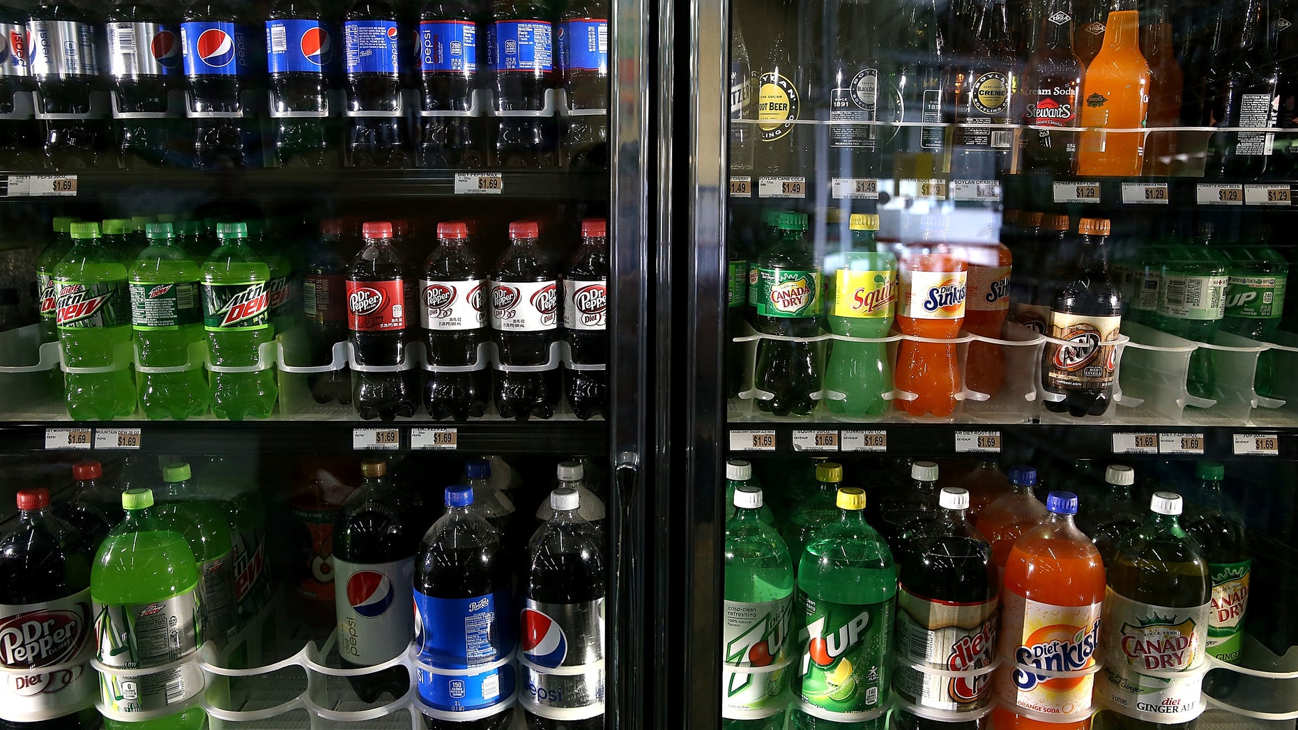 SAN FRANCISCO, CA - JULY 22: Various bottles of soda are displayed in a cooler at Marina Supermarket on July 22, 2014 in San Francisco, California. The San Francisco Board of Supervisors will vote on Tuesday to place a measure on the November ballot for a 2-cents-per-ounce soda tax. If the measure passes in the November election, tax proceeds would help finance nutrition, health, disease prevention and recreation programs. (Photo by Justin Sullivan/Getty Images)