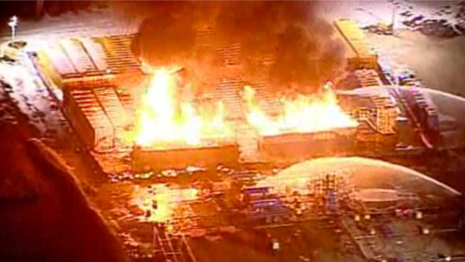 This frame grab from video provided by WPXI.com shows the gas well in Avella Penn. that exploded and caught fire injuring three workers Wednesday night Feb. 23, 2011. (AP/WPXI.com)