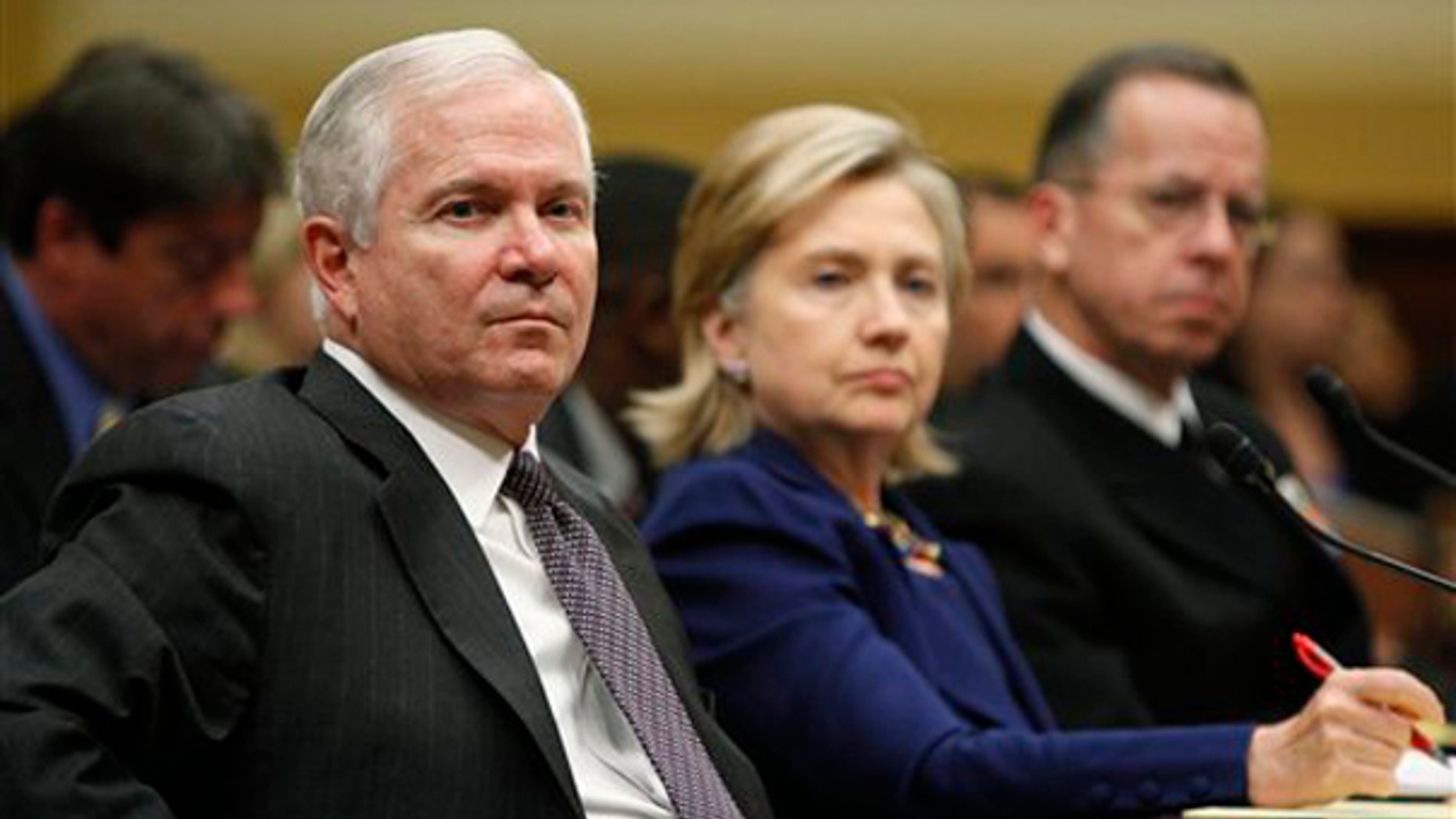 Defense Secretary Robert Gates, left, Secretary of State Hillary Clinton, middle, and Chairman of the Joint Chiefs of Staff Adm. Mike Mullen, testify on Capitol Hill Dec. 2. (AP Photo)