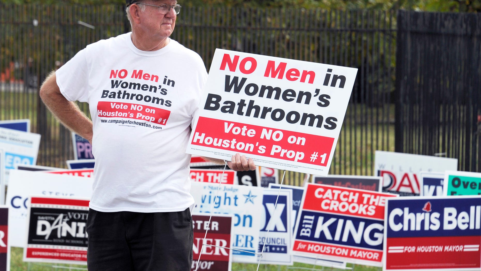 FILE -- Oct. 21, 2015: A man urges people to vote against the Houston Equal Rights Ordinance outside an early voting center in Houston. (AP Photo/Pat Sullivan)