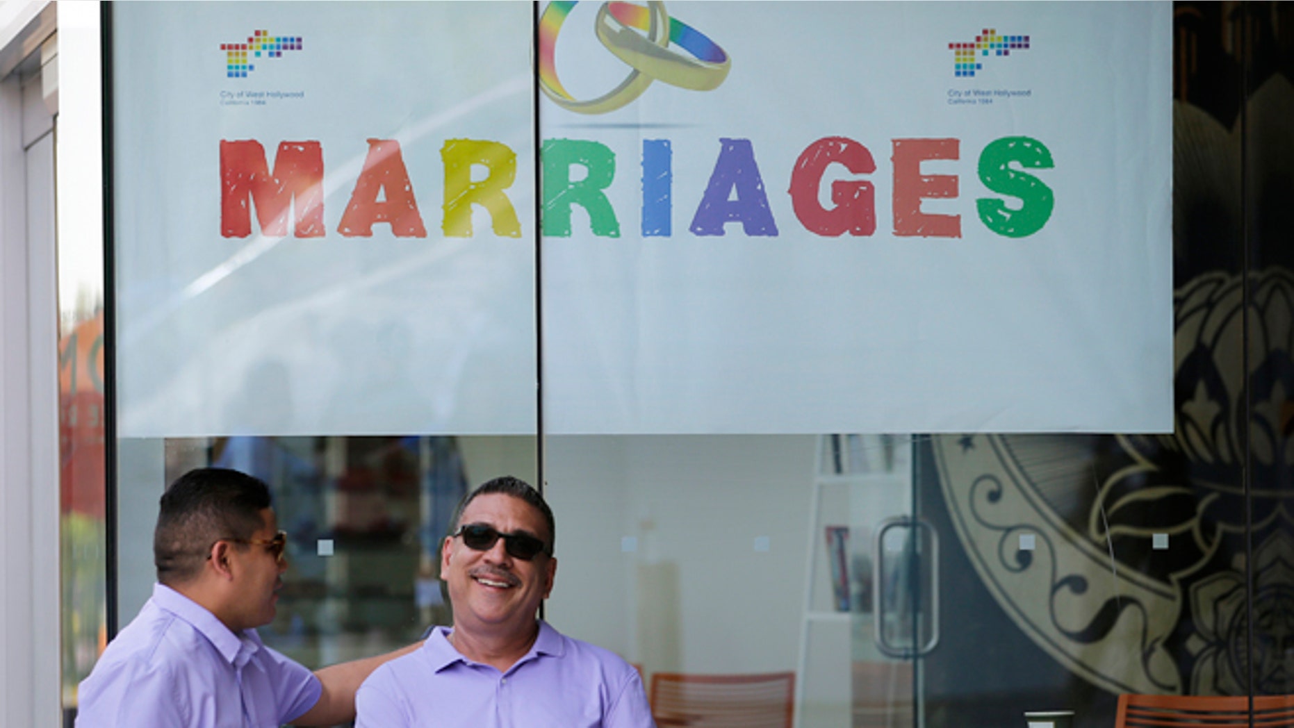 FILE: July 1, 2013: A same-sex couple before their wedding ceremony in West Hollywood, Calif.