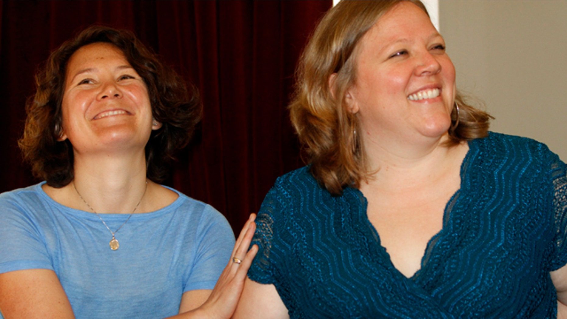 July 19: Ming Linsley, left, and Kate Baker smile during a news conference in Montpelier, Vt. The owners of a Vermont inn that refused to host the lesbian couple's wedding reception say they have no policy to discriminate against same-sex couples.