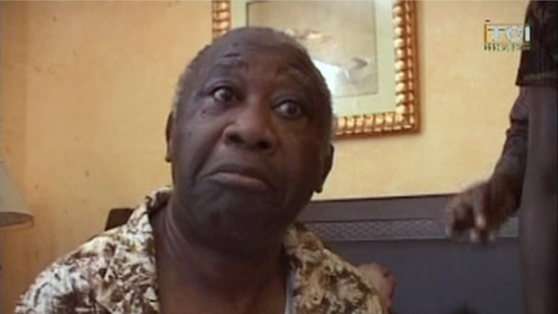 April 11: In this image made from television, Laurent Gbagbo is seen after his arrest at the Golf Hotel in Abidjan, Ivory Coast. After a week of heavy fighting, forces backing Ivory Coast's internationally recognized leader Alassane Ouattara on Monday arrested strongman Laurent Gbagbo who had refused to leave the presidency despite losing elections more than four months earlier. (AP/TCI via APTN)