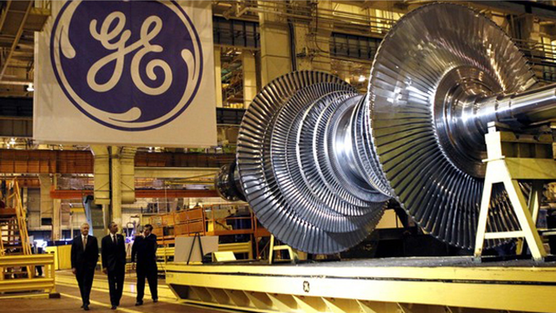 President Obama, center, passes a turbine as he tours General Electric's birthplace in Schenectady, N.Y., Jan. 21. Flanking Obama are GE CEO Jeffrey Immelt, left, and plant manager Kevin Sharkey.