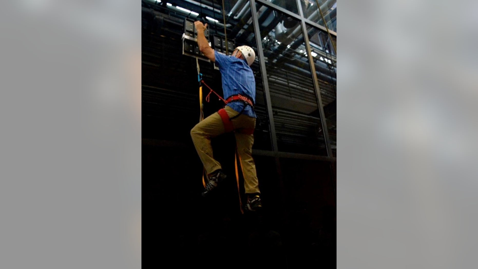 During testing, an operator climbed 25 feet vertically on a glass surface using no climbing equipment other than a pair of hand-held, gecko-inspired paddles. The climber wore, but did not require, the use of a safety belay.