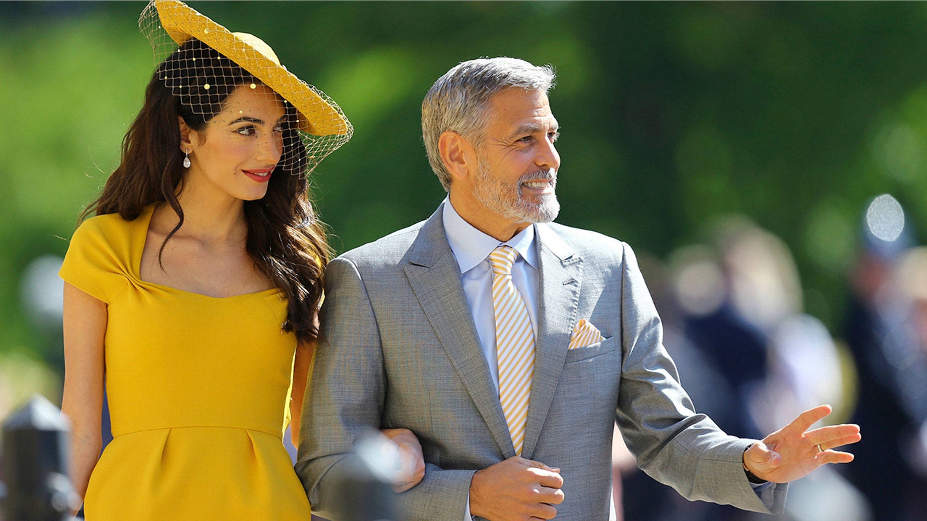 Amal Clooney and George Clooney arrive for the wedding ceremony of Prince Harry and Meghan Markle at St. George's Chapel in Windsor Castle in Windsor, near London, England, Saturday, May 19, 2018. (Gareth Fuller/pool photo via AP)