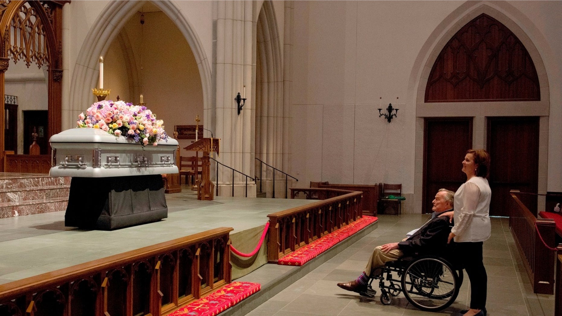 Former President George H.W. Bush was captured looking at his late wife's casket on Friday, April 20, 2018.