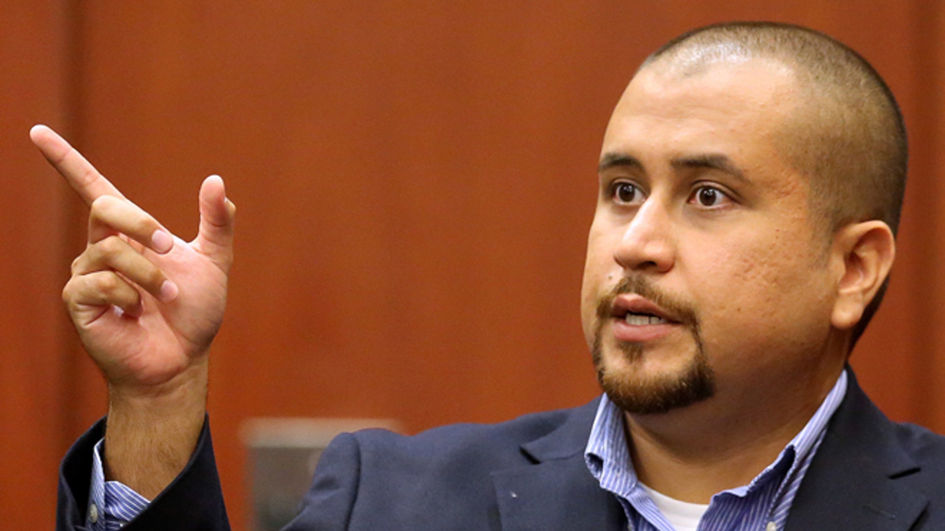 George Zimmerman gestures during his testimony at a hearing for accused shooter Matthew Apperson in September 2015.