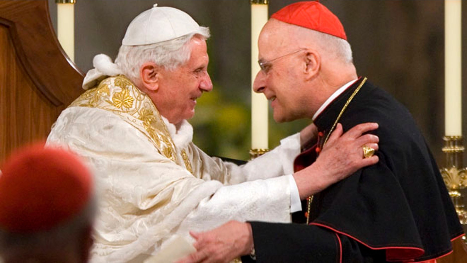 April 16, 2008: Pope Benedict XVI embraces Chicago's Cardinal Francis George after addressing the bishops at the Basilica of the National Shrine of the Immaculate Conception in Washington. (AP)