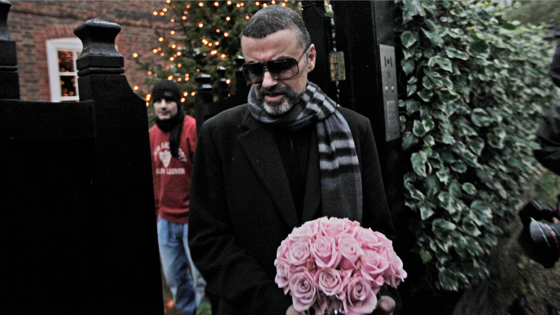 Dec. 23, 2011: George Michael leaves his house in north London, after recovering from a life-threatening bout with pneumonia that kept him in a Vienna hospital for a month.