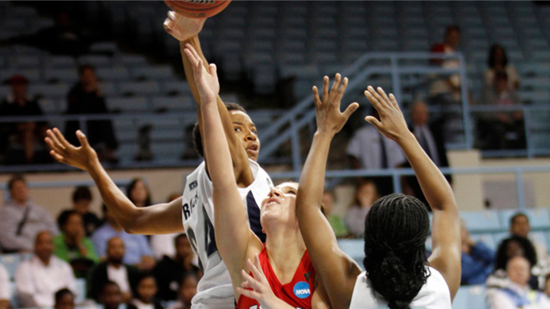 March 18: Fresno State guard Madison Parrish (11) drives to the basket past Georgetown's Amanda Reese (24) and Sugar Rodgers (14) during an NCAA women's college basketball tournament first-round game in Chapel Hill, N.C.