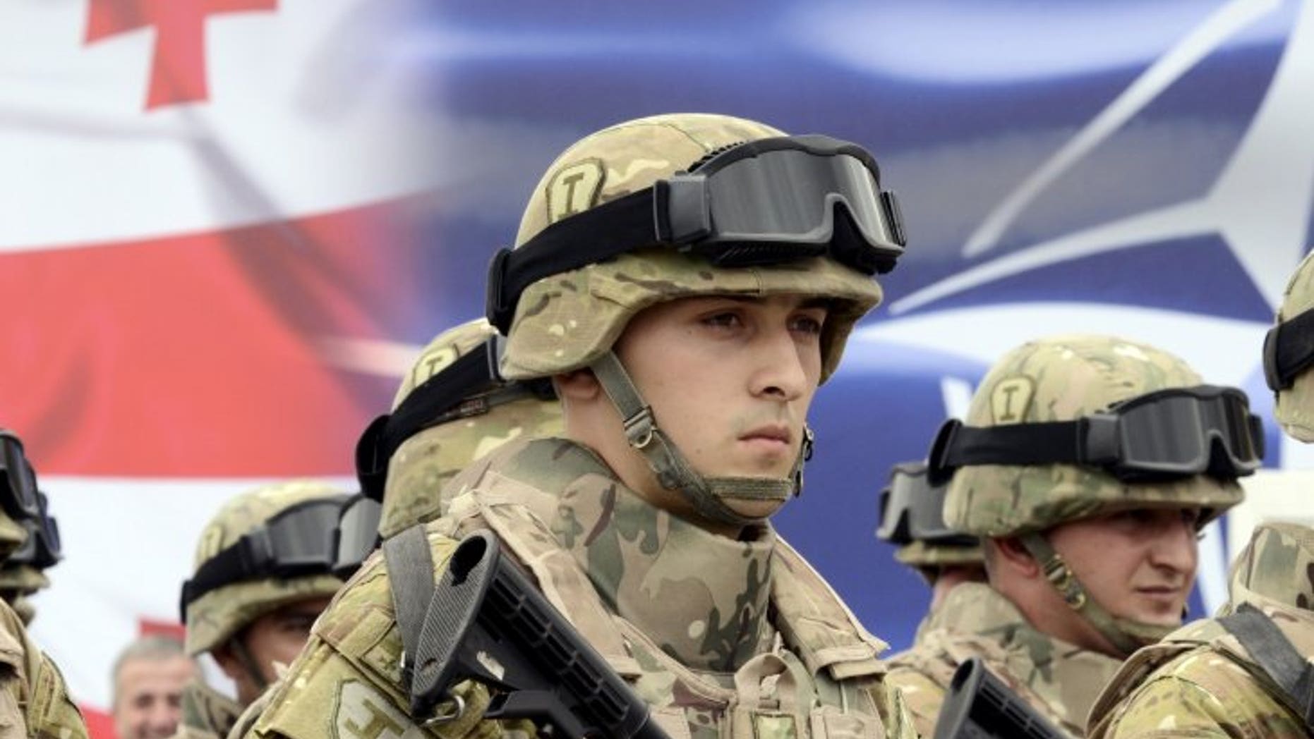 August 27, 2015: Georgian servicemen stand in formation during an opening ceremony of the Georgia-NATO joint training and evaluation center at the Krtsanisi settlement outside Tbilisi, Georgia. (Irakli Gedenidze/Reuters)