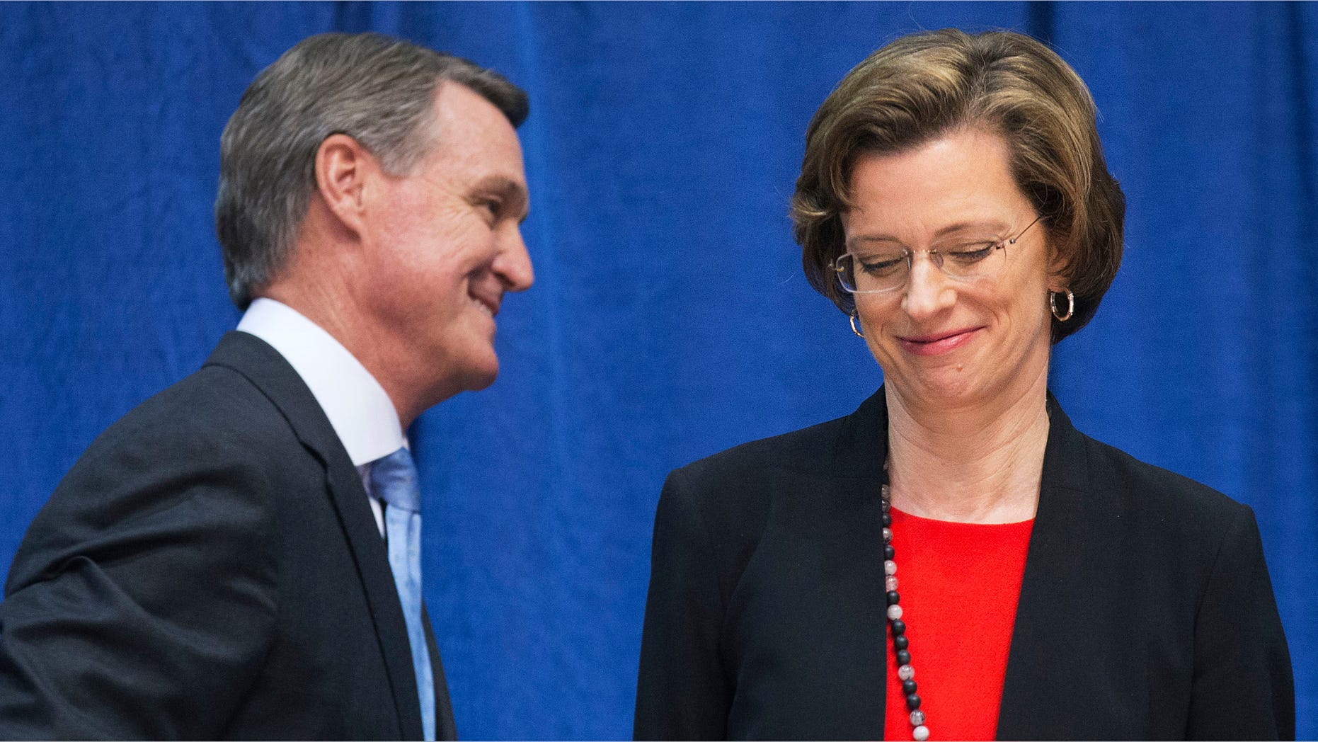 Oct. 7, 2014: Georgia Democratic candidate for U.S. Senate Michelle Nunn, right, passes Republican candidate David Perdue following a debate.