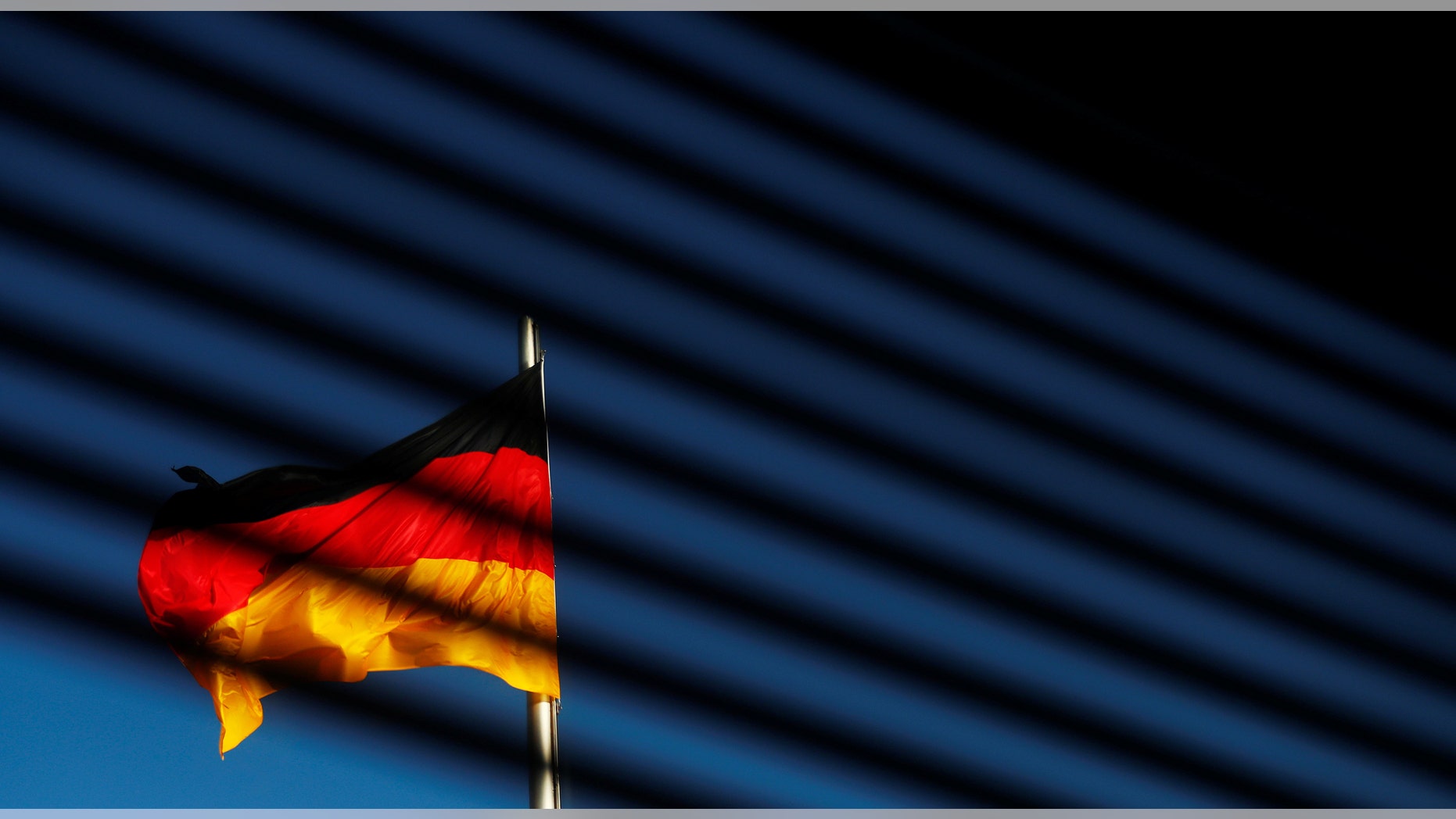 File photo - The German flag is pictured at the Reichstag building in Berlin, Germany, Nov. 7, 2017. (REUTERS/Hannibal Hanschke)