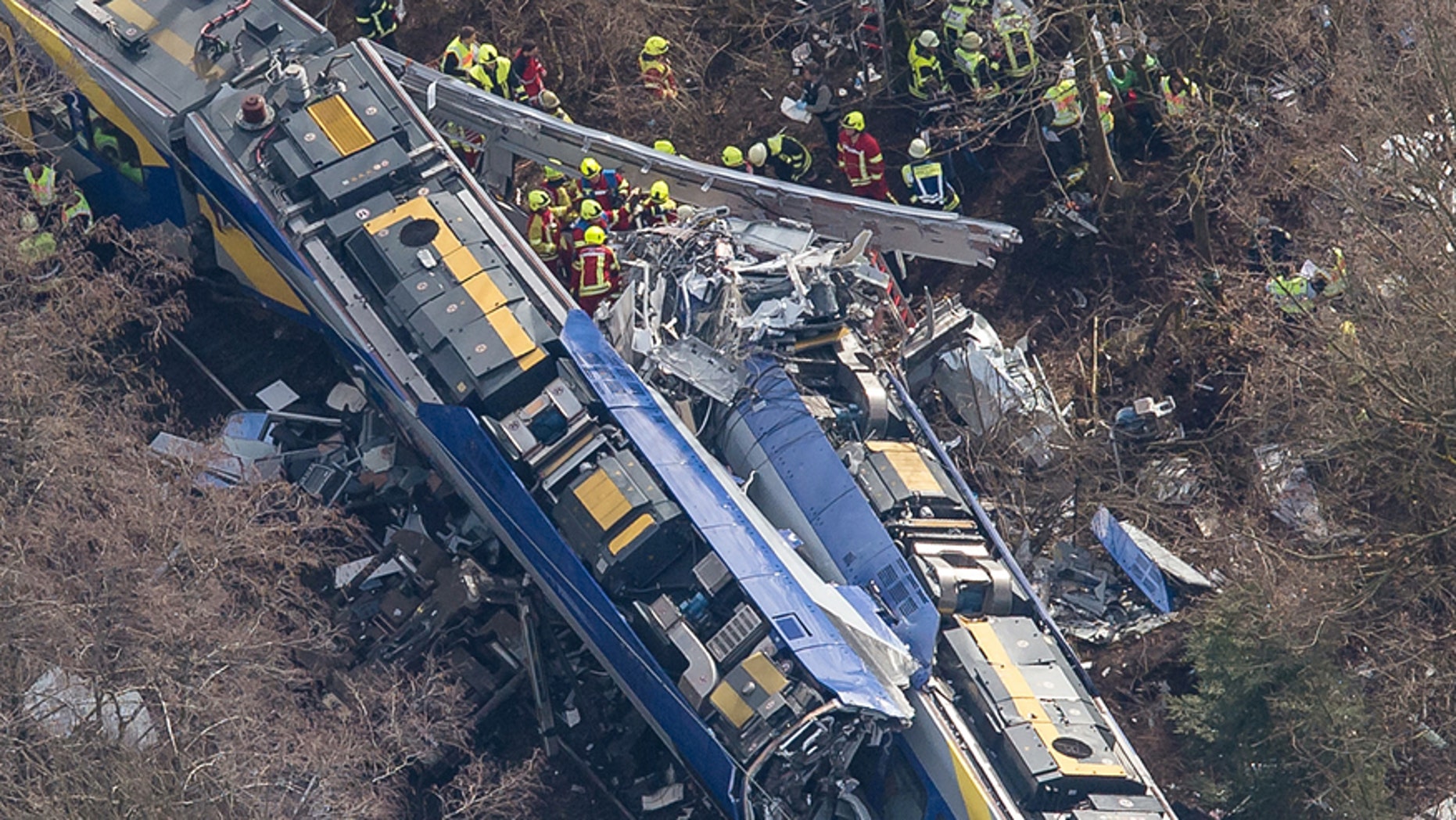 Aerial view of rescue forces working at the site of a train accident near Bad Aibling, Germany, Tuesday, Feb. 9, 2016. Several people were killed when two trains collided head-on. (Peter Kneffel/dpa via AP)